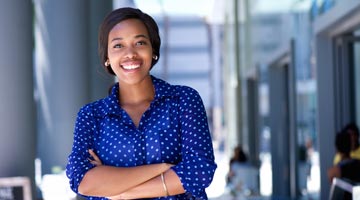 woman smiling with her arms crossed