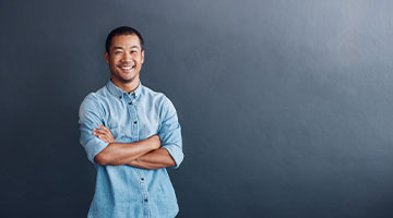 Digital Marketer with arms crossed smiling