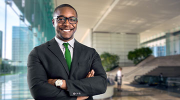 IT Manager with his arms crossed smiling