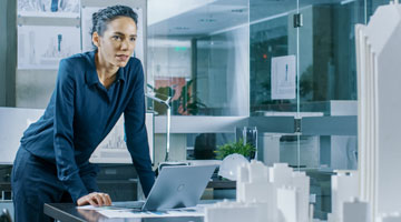 Engineers viewing computer models