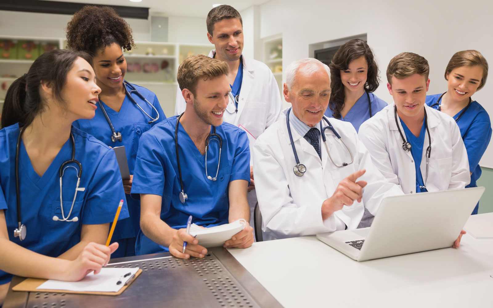 Group of recent online health care graduates walking to their next assignment