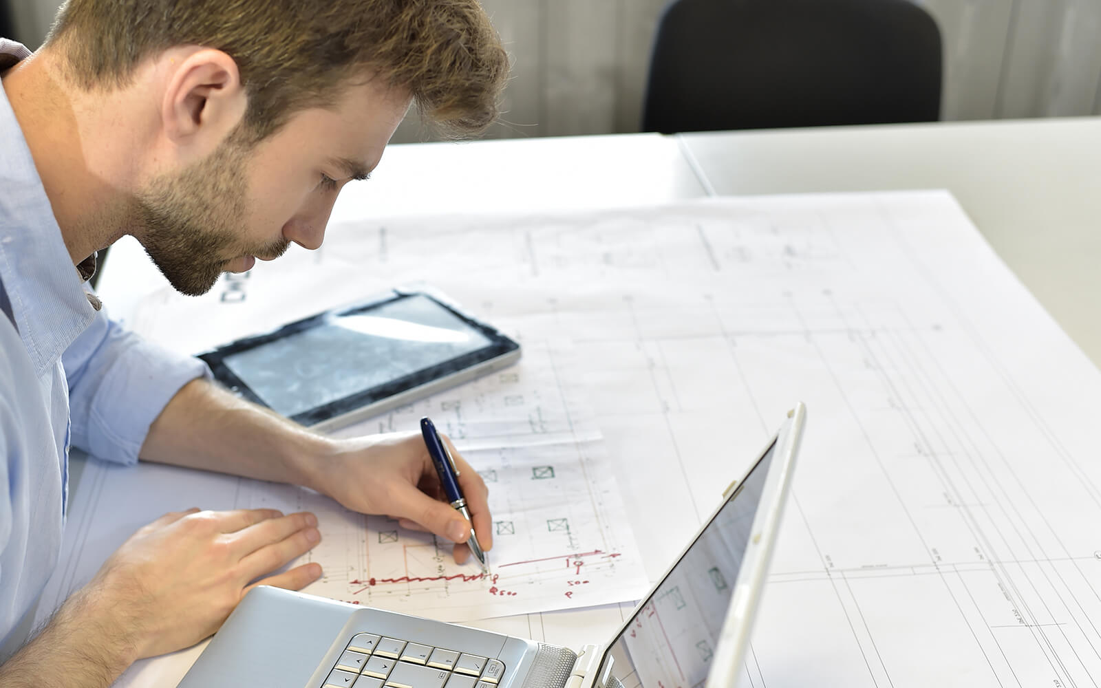 Construction engineer reviewing plans