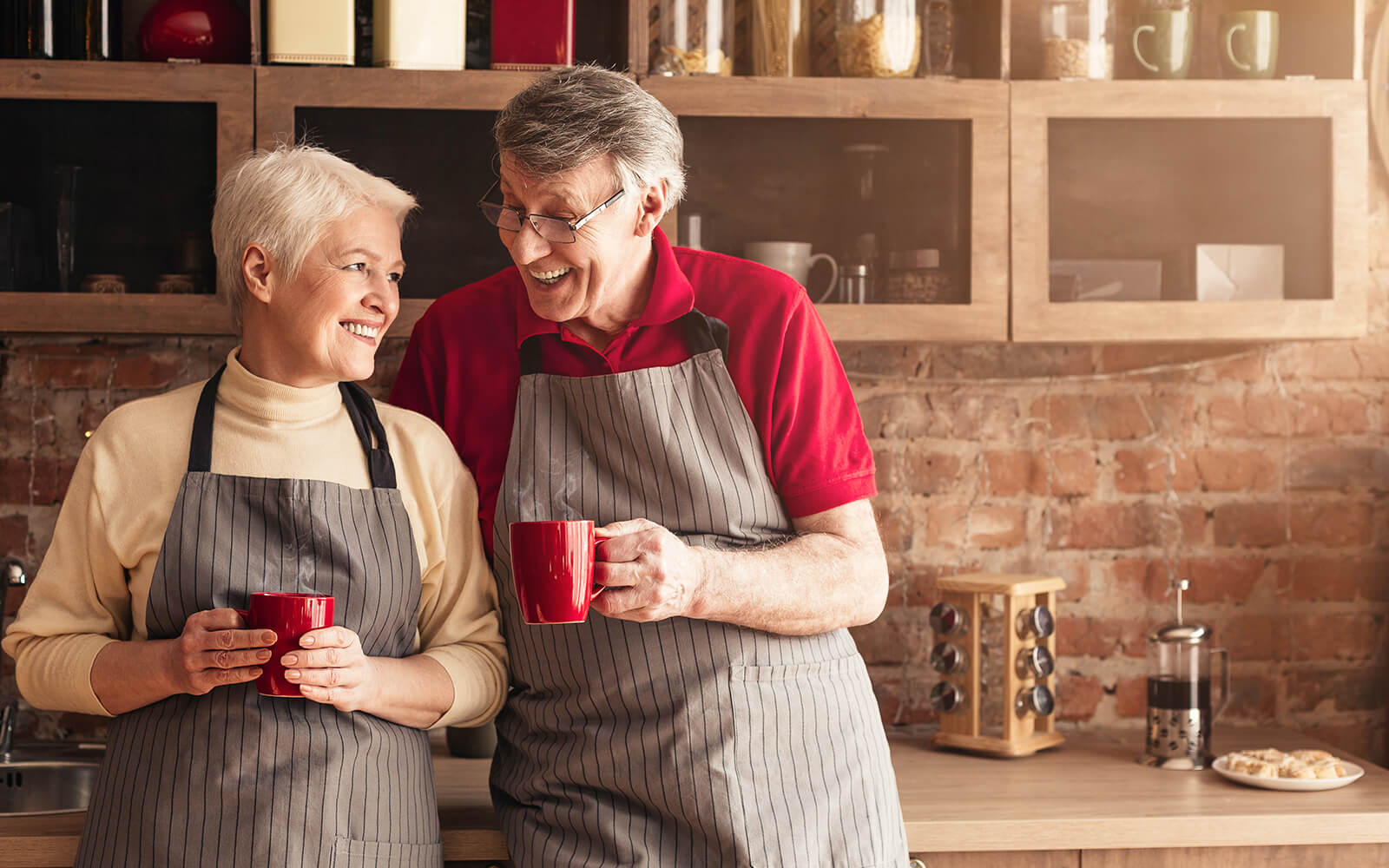 Couple drinking coffee in kitchen