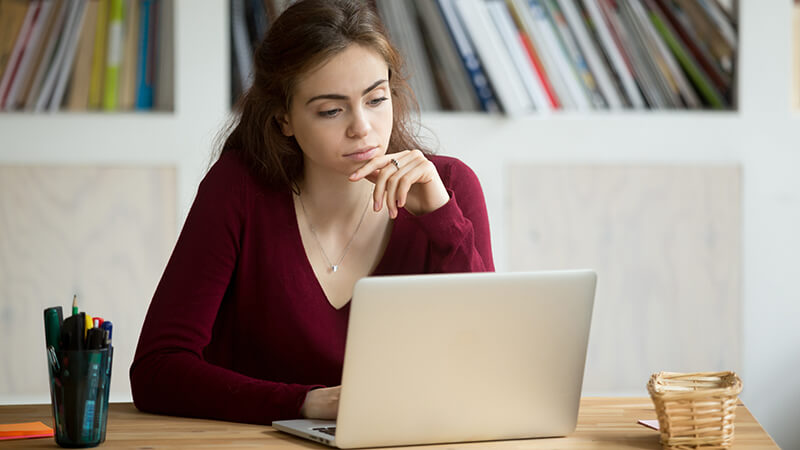 Woman browsing her computer