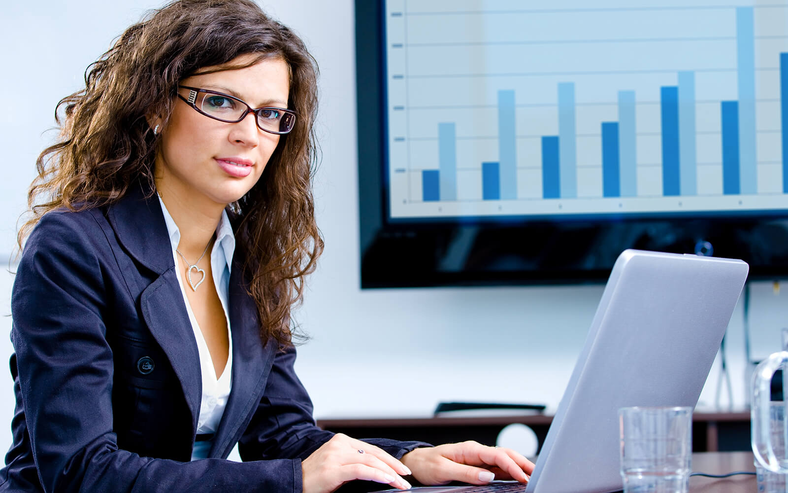 Woman working on her laptop at desk