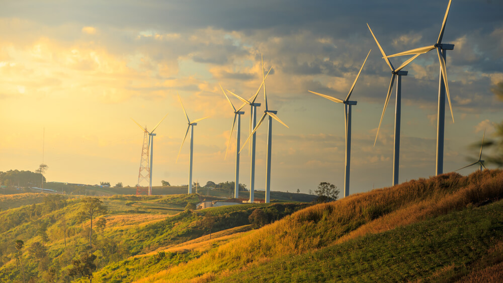 Wind turbines on a hillside.