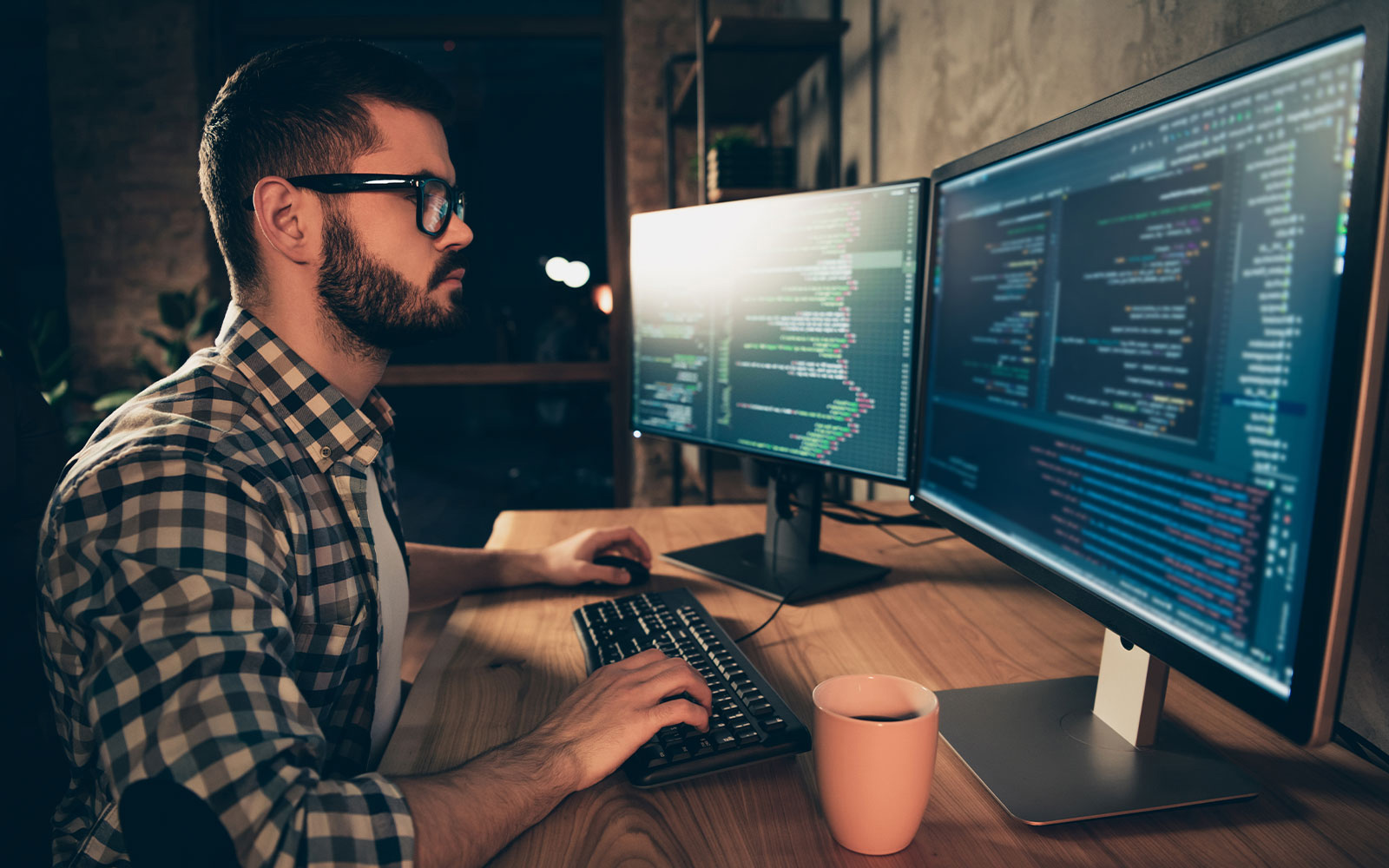 Man coding at his desk