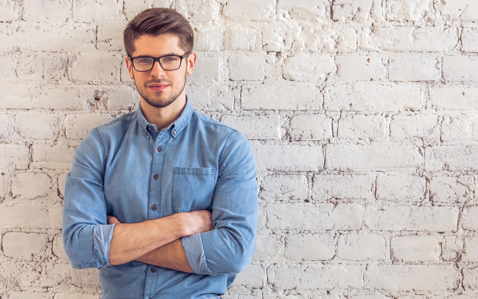 Man standing with his arms folded