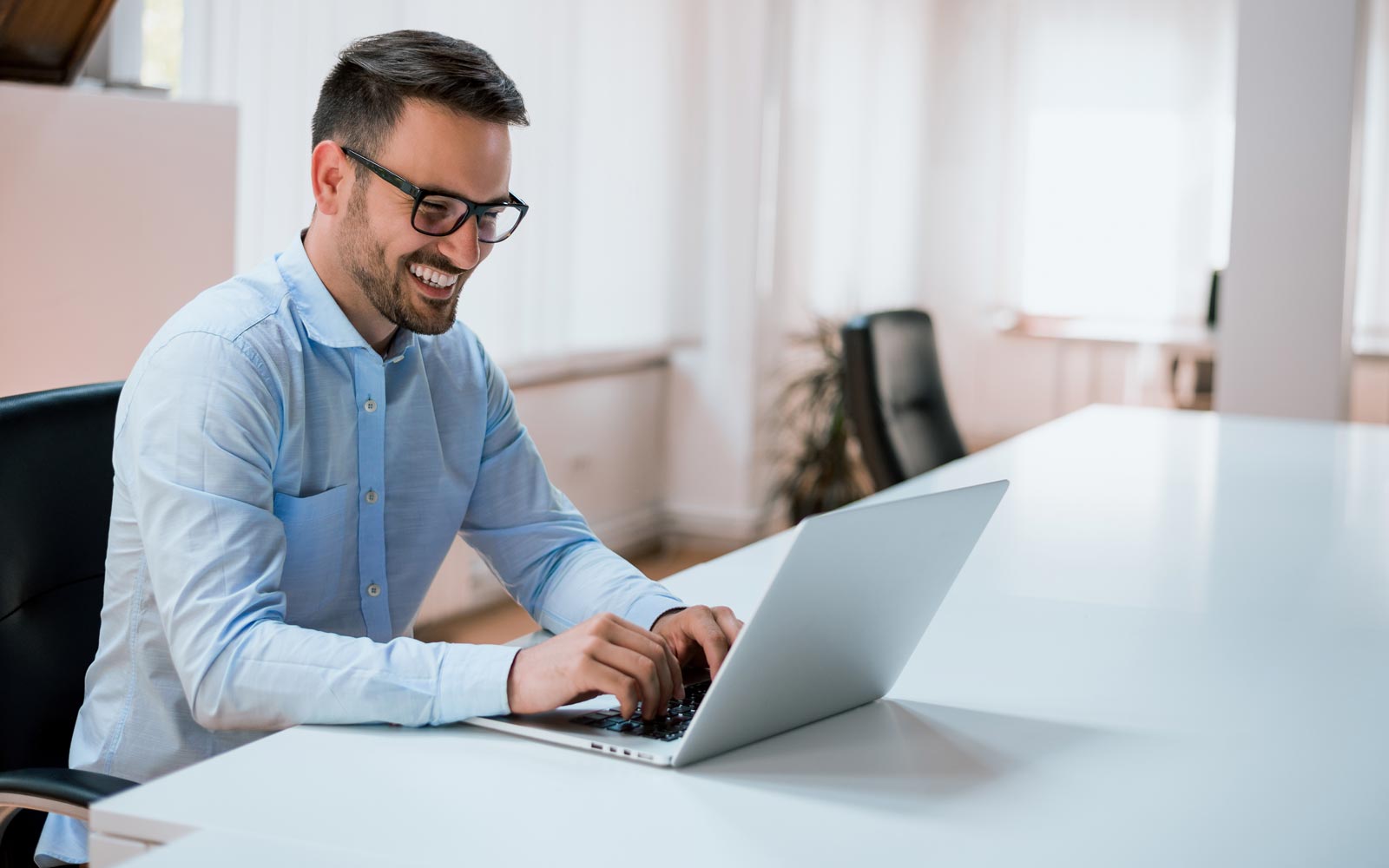 Facility manager working on his laptop