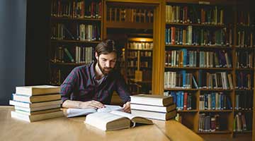 Man studying in library