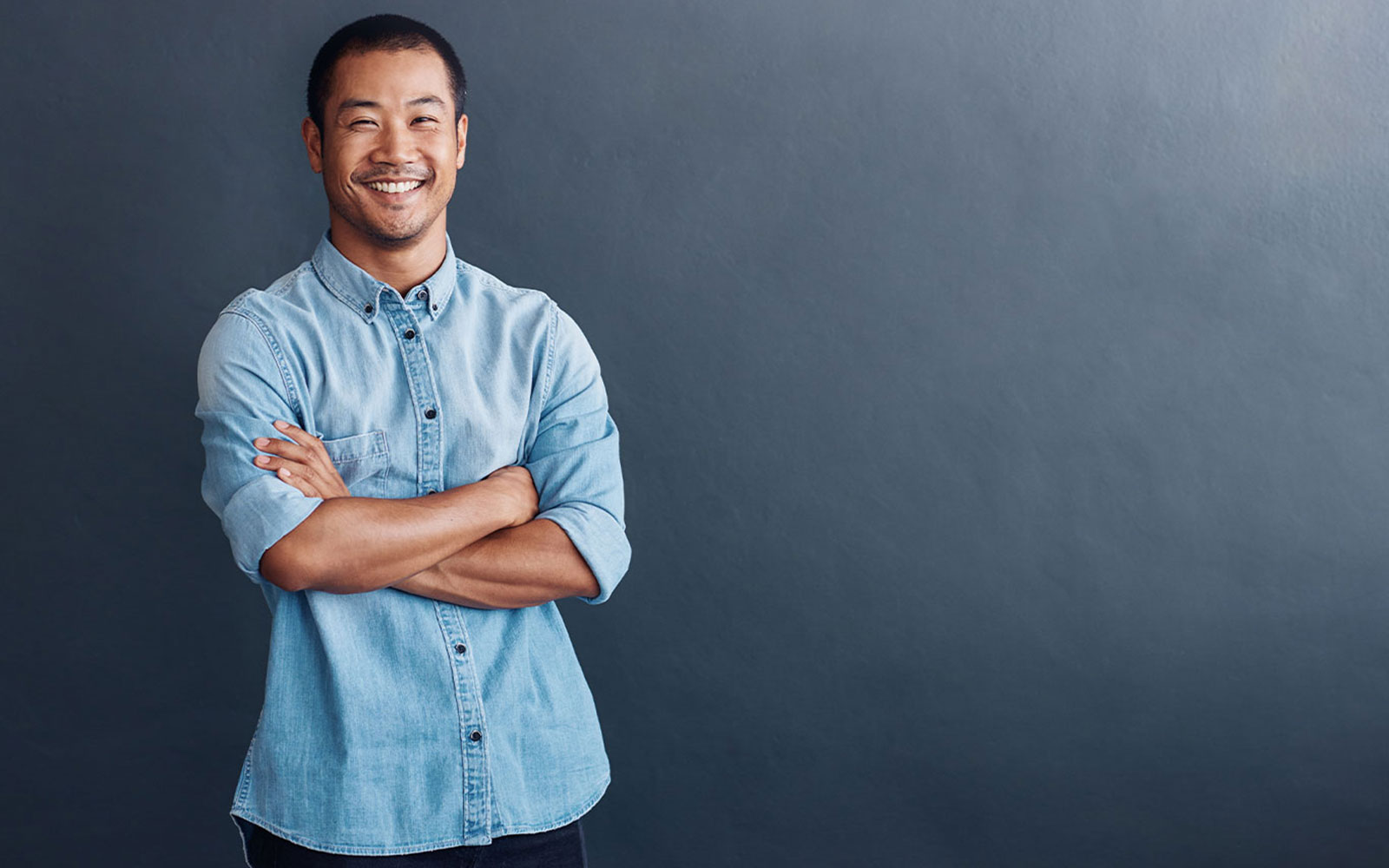 Digital Marketer with arms crossed smiling