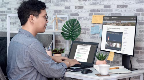 Man viewing the Faculty Technology Center website at his desk