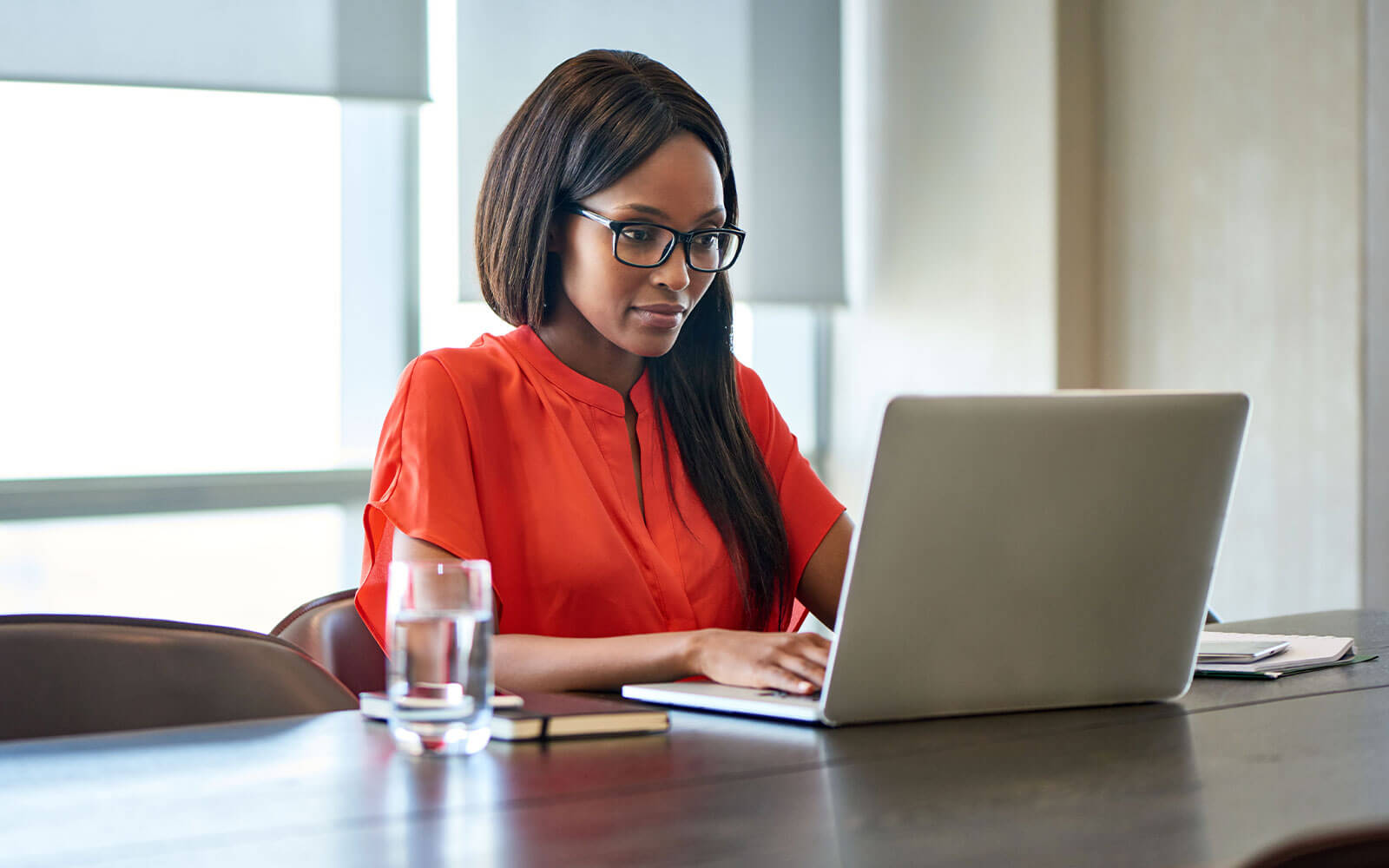 Woman working on her laptop at desk