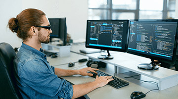 Information tech working on a computer