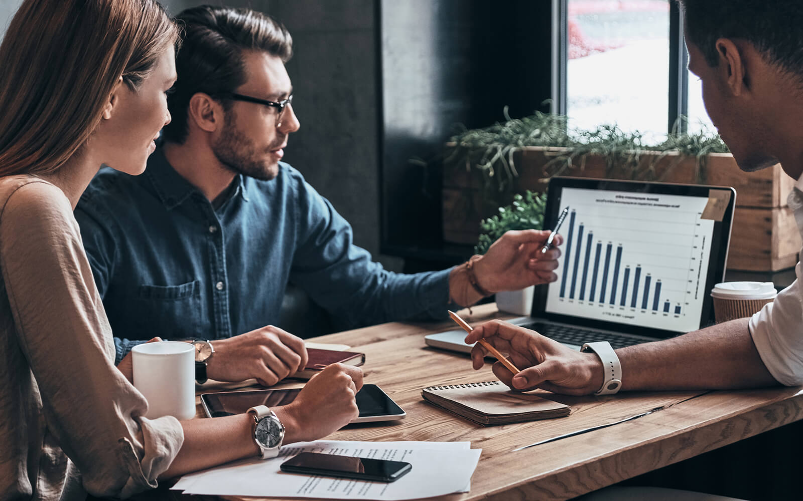 Marketing manager review stats with clients