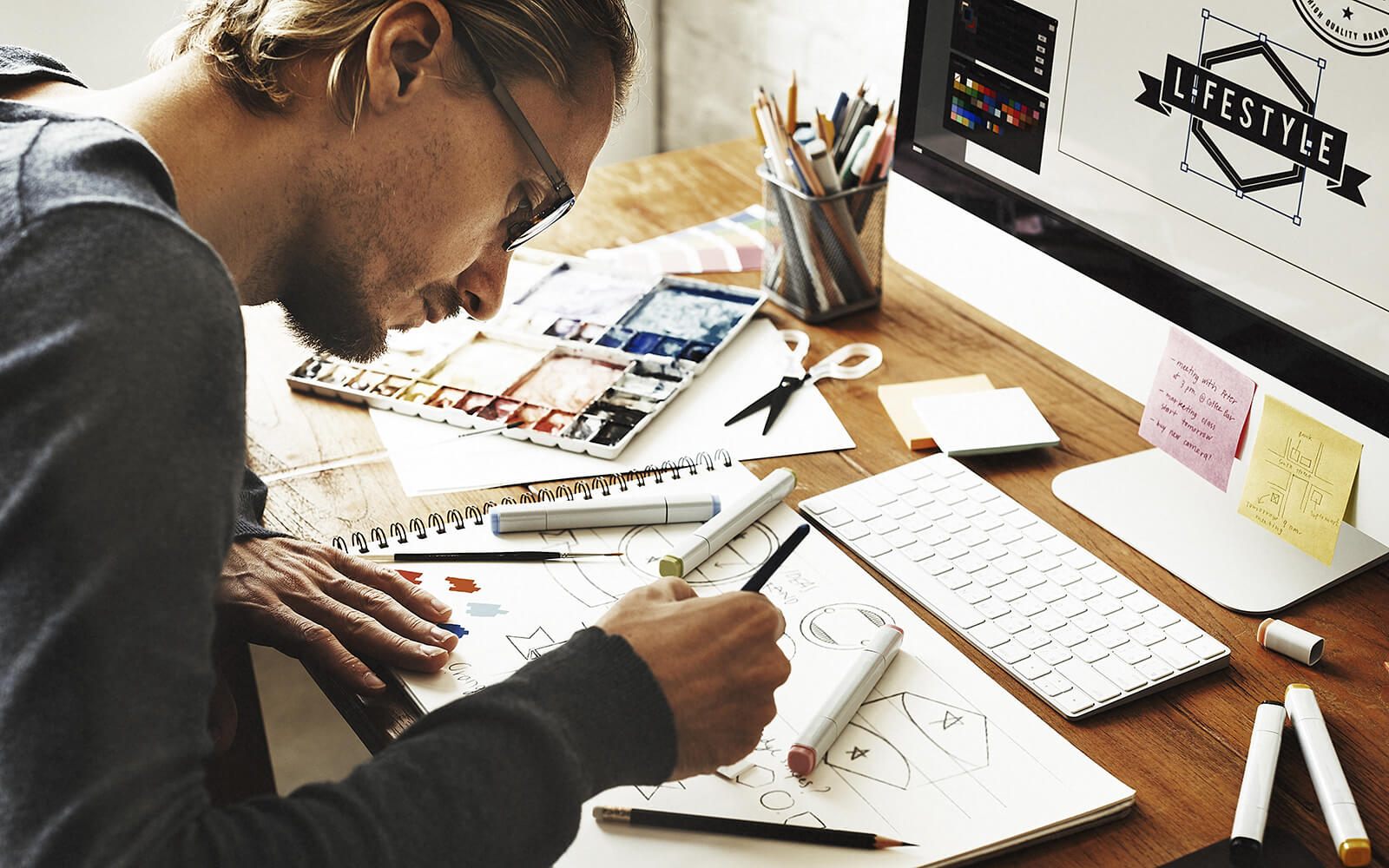 Graphic designer working at his desk