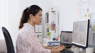 Data analyst working at her computer