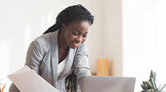 Woman looking at a book in a library