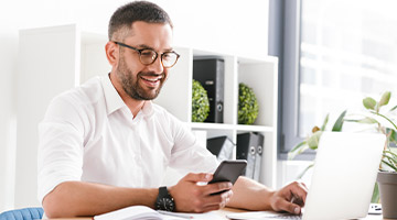 Finance advisor looking at his phone