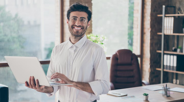 Financial advisor holding a laptop