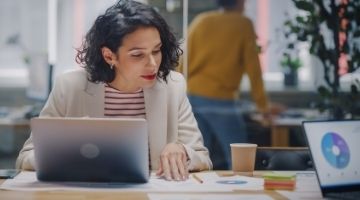 International business manager working at his desk