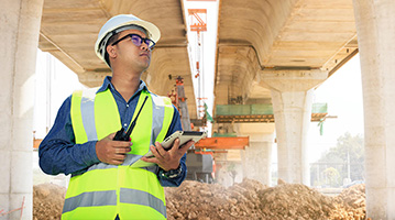 Transportation engineer inspecting a bridge
