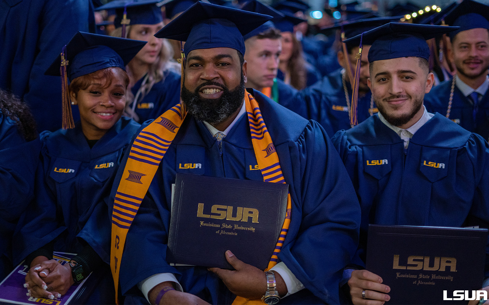 a group of students in cap and gown at their graduation