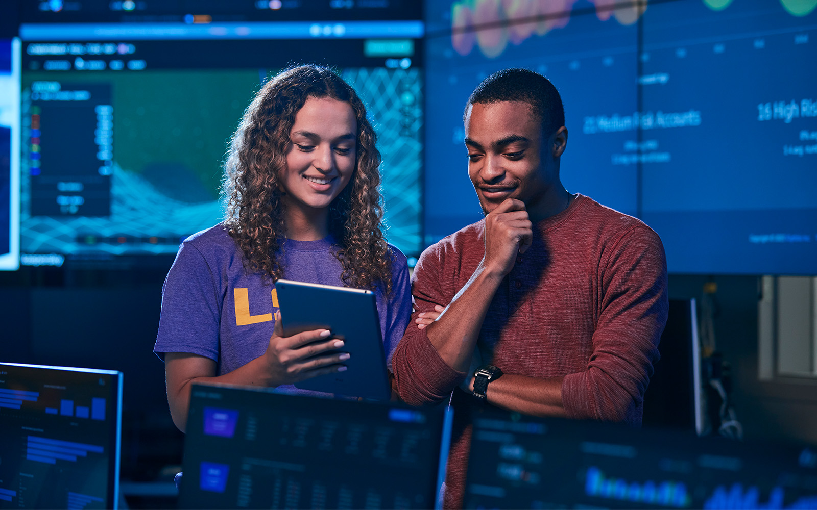 2 cyber security engineers working in a lab