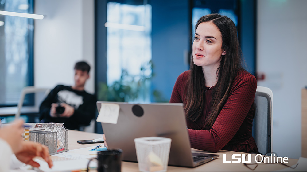 Woman smiling at laptop
