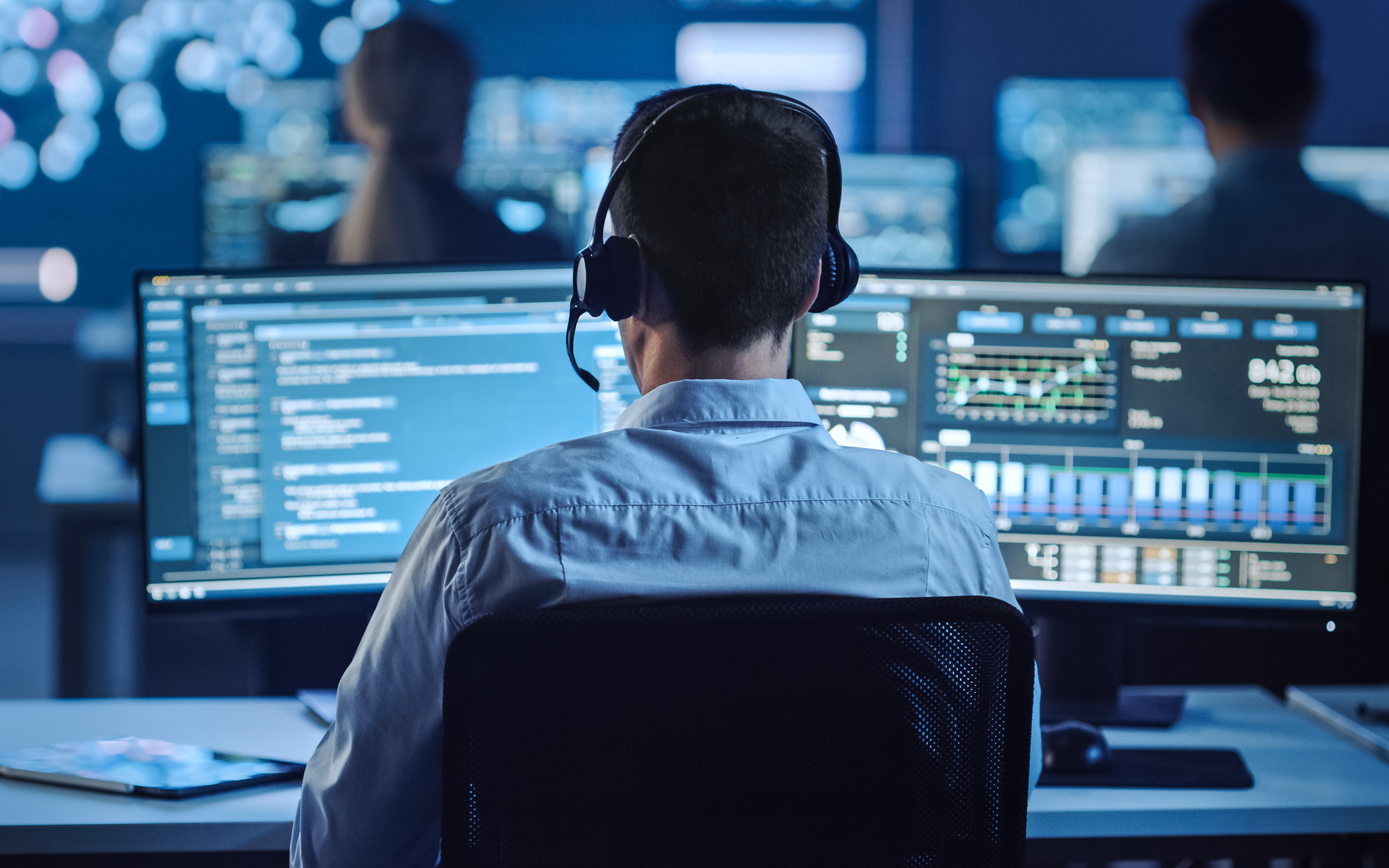 2 cyber security engineers working in a lab