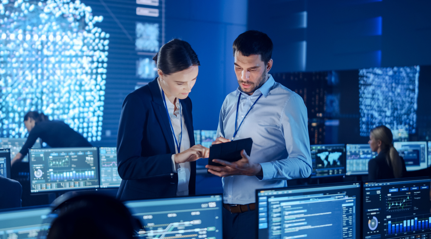 2 cyber security engineers working in a lab
